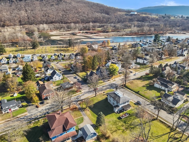 bird's eye view with a water and mountain view