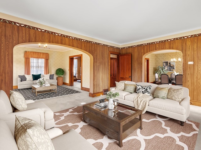 carpeted living room with ornamental molding