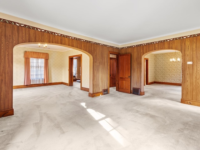 unfurnished room with carpet flooring and ornamental molding