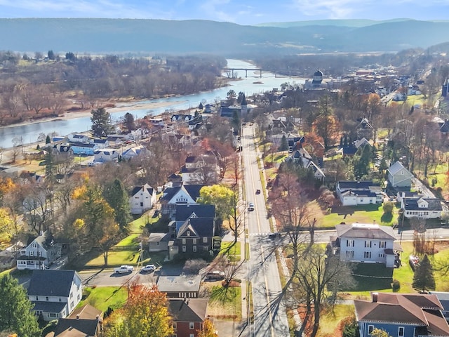 bird's eye view with a water and mountain view