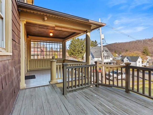 wooden deck with a mountain view