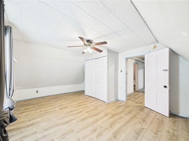 712 W Main St, Smethport, PA 16749 - additional living space featuring light wood-style flooring, ceiling fan, vaulted ceiling, and baseboards