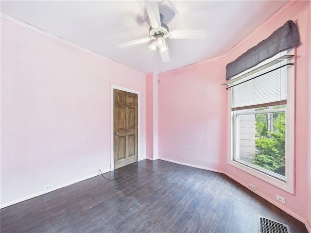 712 W Main St, Smethport, PA 16749 - spare room with a ceiling fan, dark wood-style flooring, baseboards, and ornamental molding