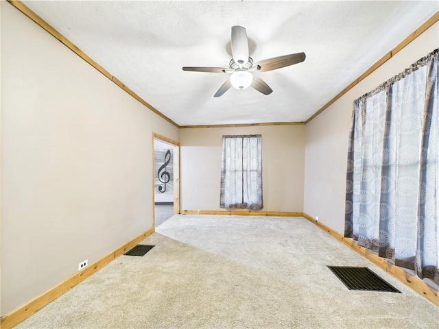 712 W Main St, Smethport, PA 16749 - carpeted spare room featuring baseboards, ornamental molding, and a ceiling fan