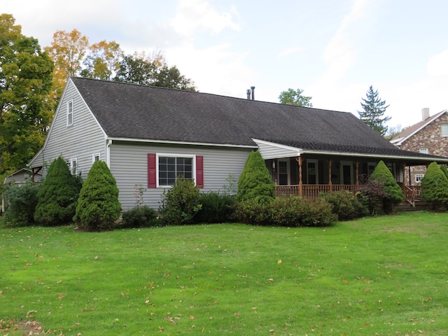 exterior space with a front lawn and a porch