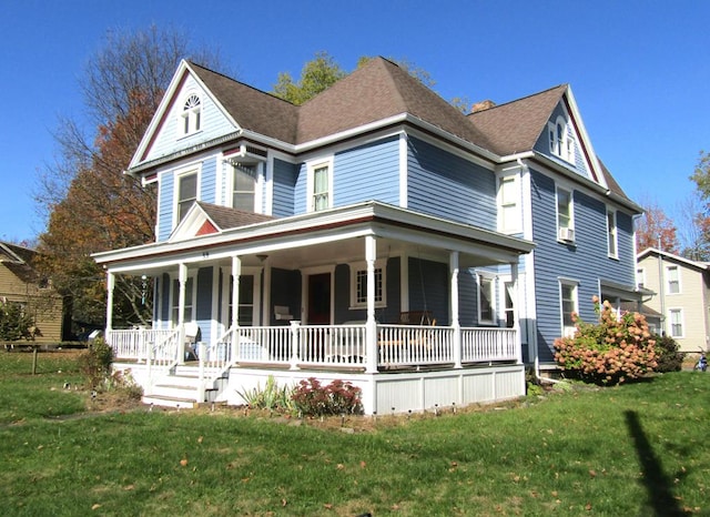 victorian-style house with covered porch and a front yard