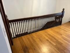 staircase with hardwood / wood-style floors and radiator heating unit