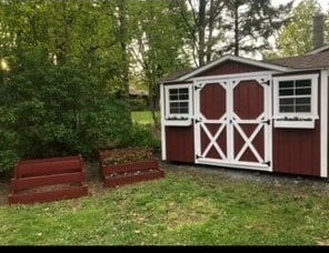 view of outdoor structure featuring a lawn