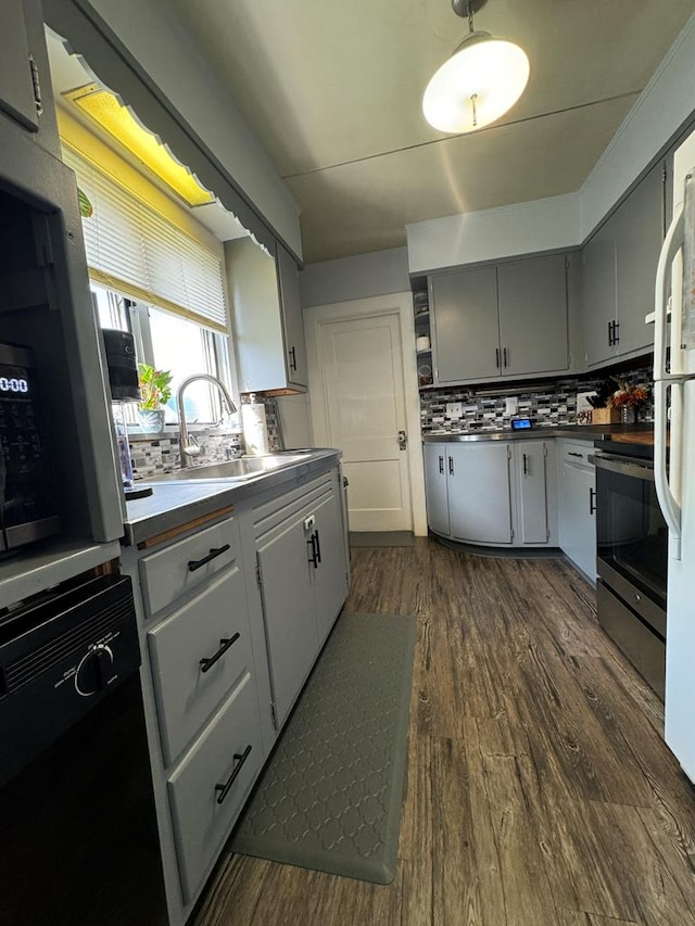 kitchen with dark wood-type flooring, sink, black dishwasher, electric stove, and decorative backsplash