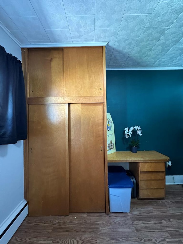 closet with a baseboard heating unit