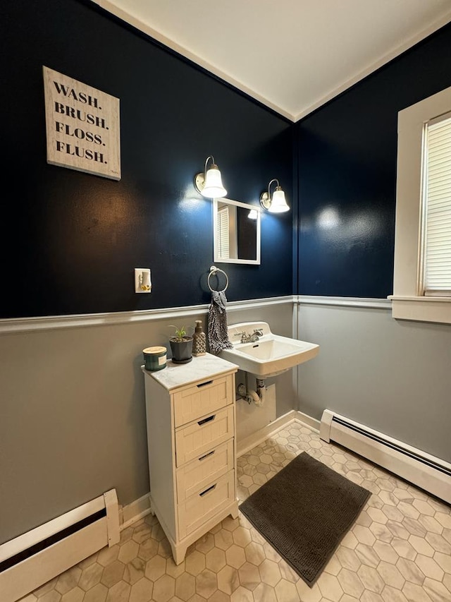 bathroom featuring sink, tile patterned floors, and baseboard heating