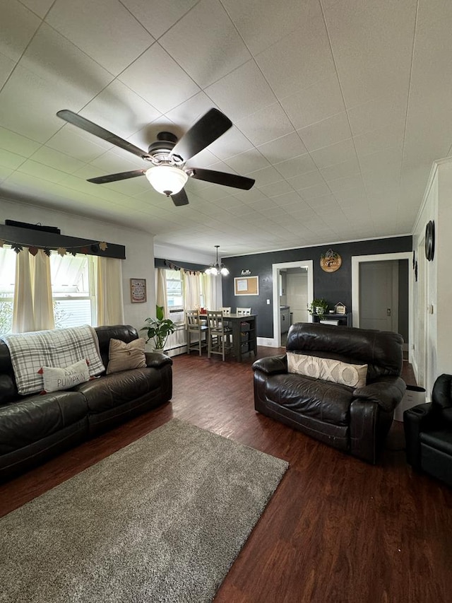 living room with dark hardwood / wood-style flooring and ceiling fan