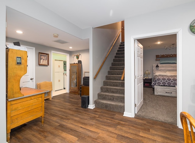 interior space featuring visible vents, recessed lighting, stairs, and wood finished floors