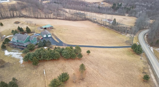 birds eye view of property with a rural view