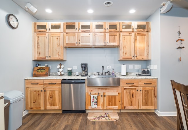 kitchen featuring visible vents, glass insert cabinets, stainless steel dishwasher, dark wood-style floors, and a sink