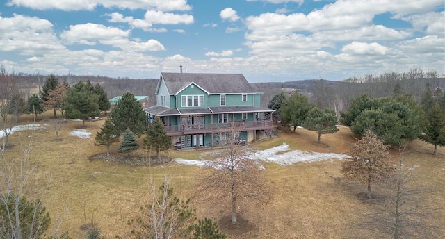 back of property featuring a wooden deck and stairs