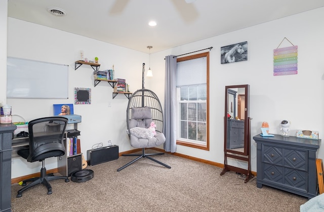 carpeted office space with visible vents and baseboards