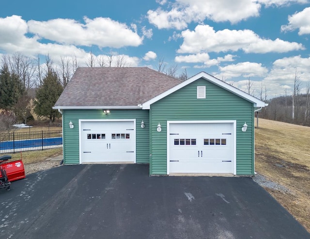 garage with fence