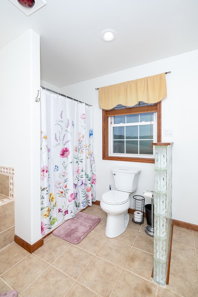 full bathroom with tile patterned floors, baseboards, toilet, and a shower with shower curtain