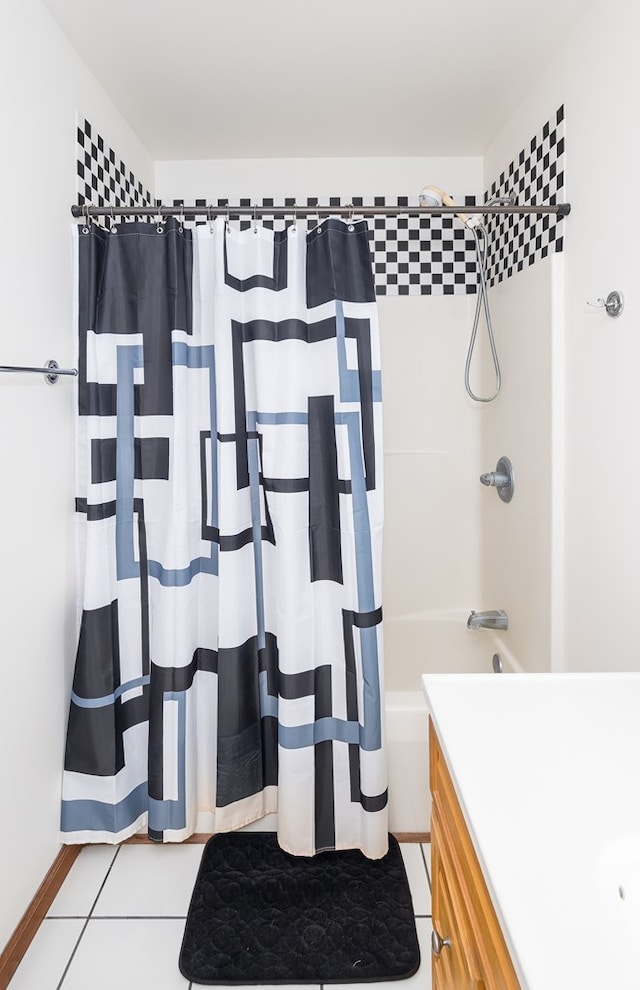 full bath with tile patterned flooring, vanity, and shower / bath combo