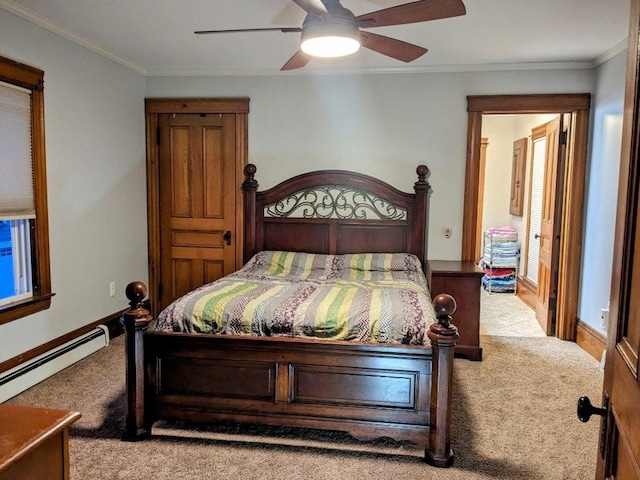 carpeted bedroom featuring ceiling fan and crown molding