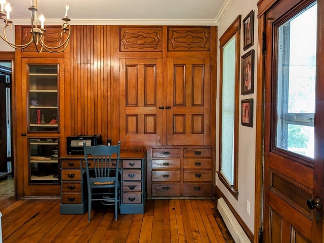 home office with baseboard heating, crown molding, a chandelier, and dark hardwood / wood-style floors