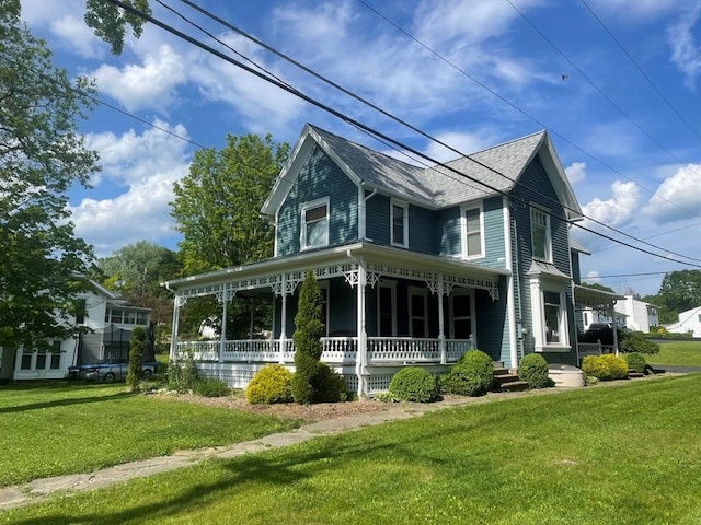 view of home's exterior with a lawn and covered porch