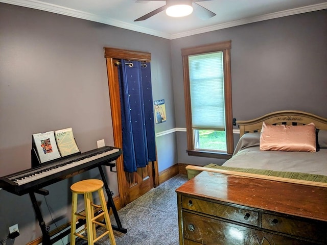 bedroom featuring dark colored carpet, ceiling fan, and crown molding