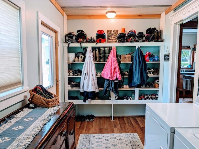 mudroom with hardwood / wood-style floors, plenty of natural light, and washing machine and clothes dryer