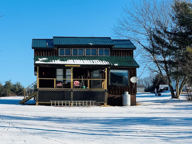 view of snow covered house