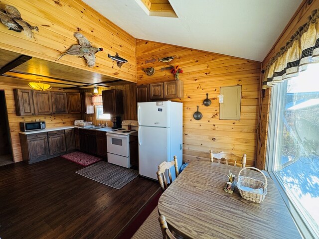 kitchen featuring wooden walls, lofted ceiling, electric panel, dark wood-type flooring, and white appliances