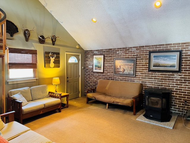 carpeted living room featuring lofted ceiling, a textured ceiling, and a wood stove