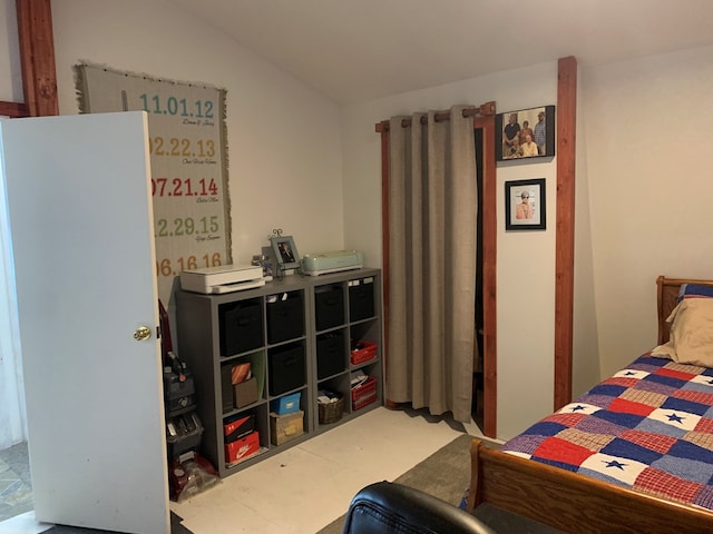 bedroom featuring vaulted ceiling