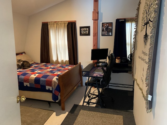 bedroom featuring lofted ceiling