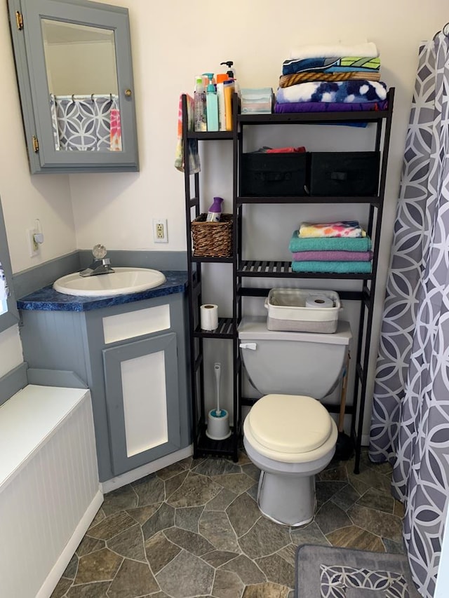 bathroom featuring vanity and toilet