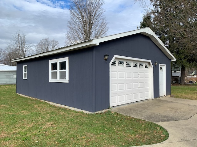 garage featuring a yard