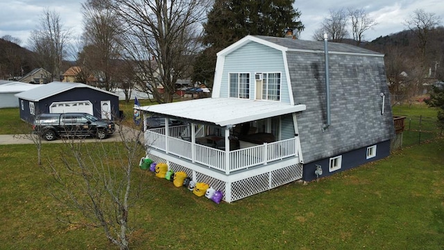 exterior space featuring a lawn and covered porch