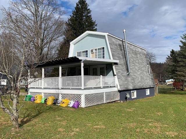 back of property featuring a yard