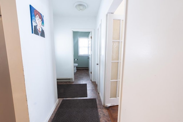 hallway featuring a baseboard heating unit