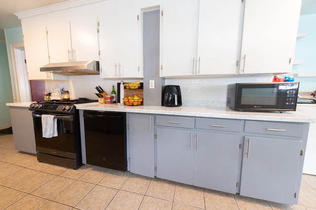 kitchen featuring backsplash, gray cabinets, white cabinetry, and black appliances