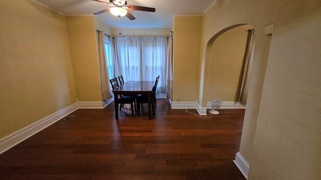 306 Broad St, Port Allegany, PA 16743 - dining room featuring arched walkways, wood finished floors, a ceiling fan, and crown molding