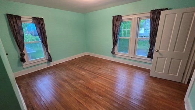 306 Broad St, Port Allegany, PA 16743 - empty room with dark wood finished floors and baseboards