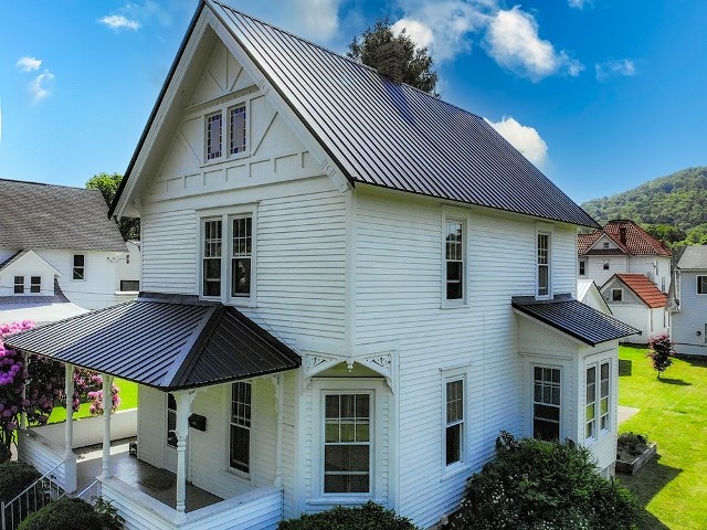 306 Broad St, Port Allegany, PA 16743 - rear view of house with a standing seam roof, a metal roof, and a yard
