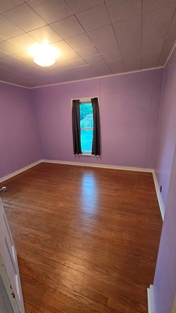306 Broad St, Port Allegany, PA 16743 - empty room with wood finished floors and ornamental molding