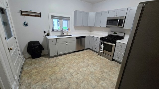 306 Broad St, Port Allegany, PA 16743 - kitchen featuring appliances with stainless steel finishes, gray cabinetry, ornamental molding, and light countertops