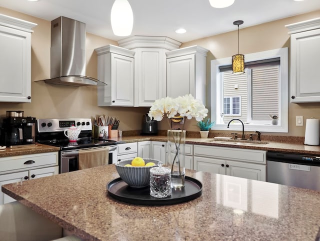 109 Alden St, Sayre, PA 18840 - kitchen featuring appliances with stainless steel finishes, wall chimney range hood, a sink, white cabinets, and recessed lighting