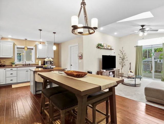 109 Alden St, Sayre, PA 18840 - dining room with dark wood-style flooring, recessed lighting, a chandelier, a skylight, and ceiling fan