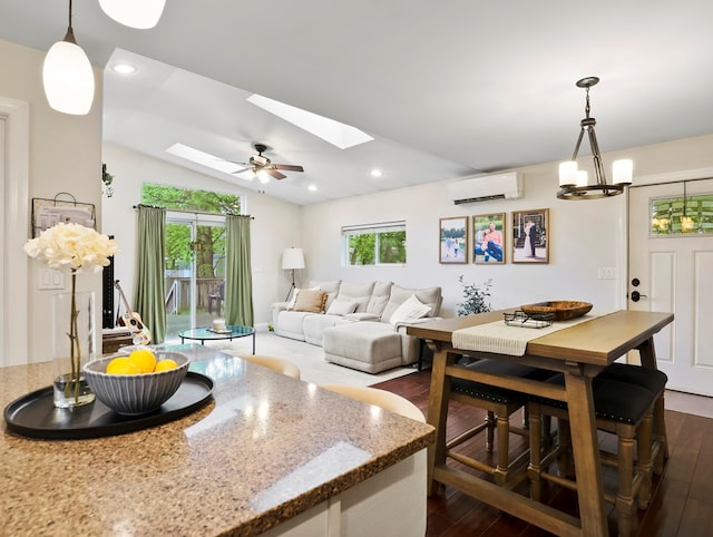 109 Alden St, Sayre, PA 18840 - dining room with a wall mounted air conditioner, dark wood-style flooring, a skylight, a chandelier, and vaulted ceiling
