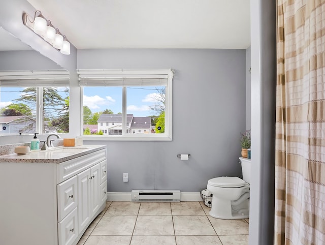 109 Alden St, Sayre, PA 18840 - bathroom featuring baseboard heating, vanity, toilet, baseboards, and tile patterned floors