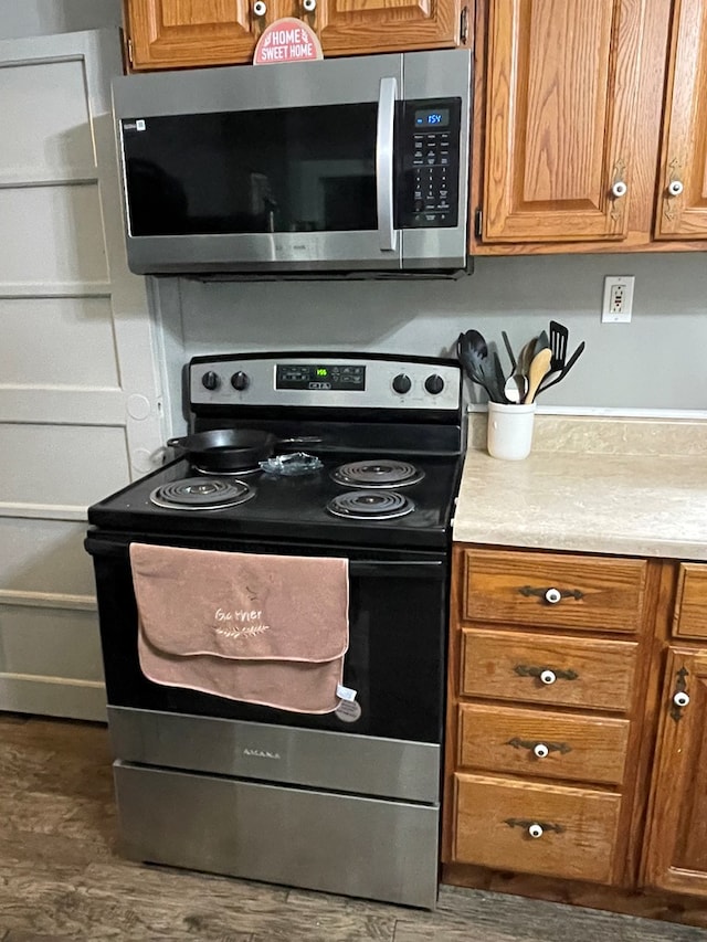 19 Kline Rd, Galeton, PA 16922 - kitchen with stainless steel appliances, light countertops, wood finished floors, and brown cabinetry